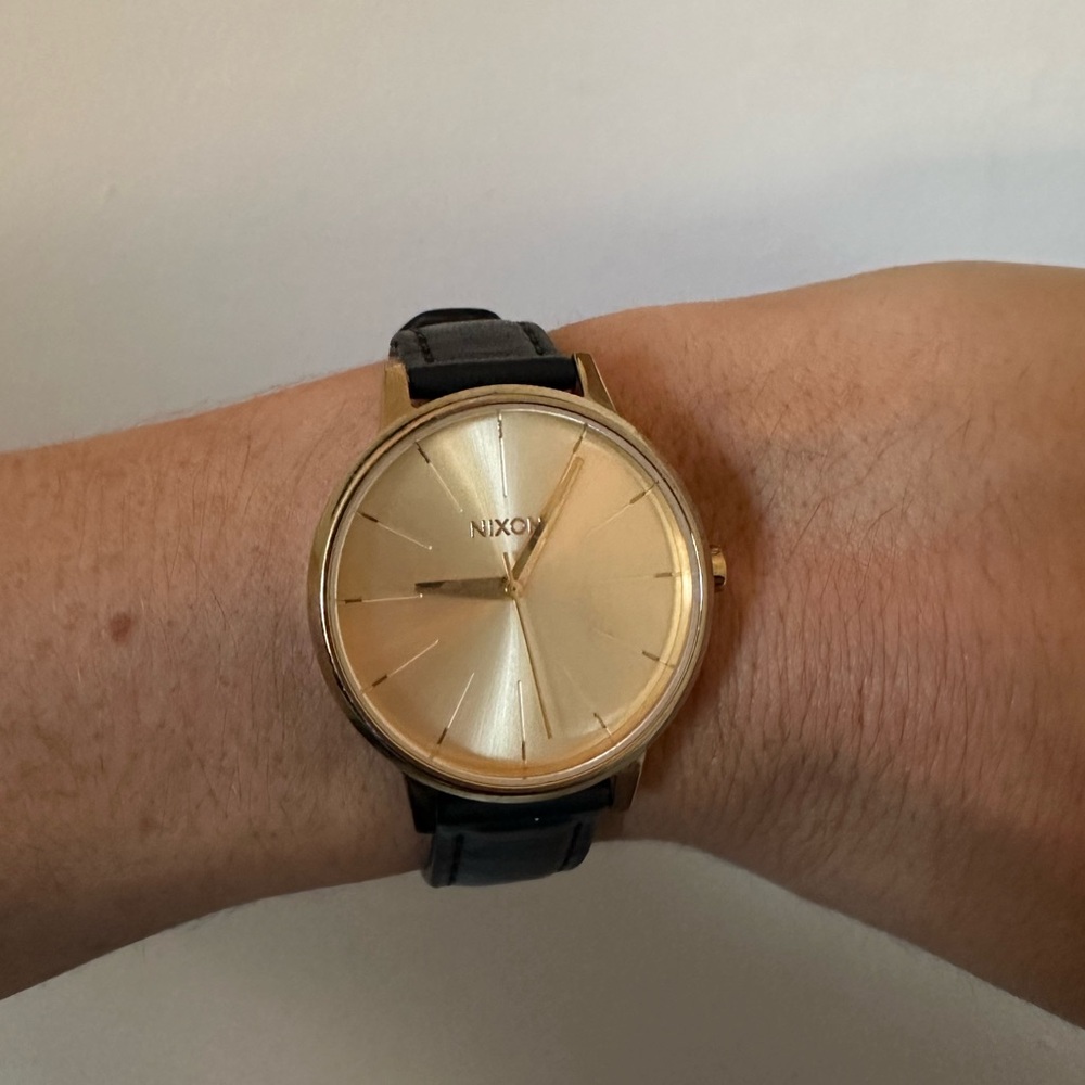 Nixon Women’s Watch with Gold Dial and Black Leather Strap